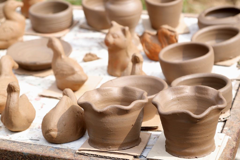 Handmade ceramic pottery on display, showcasing rustic charm and artistic craftsmanship.
